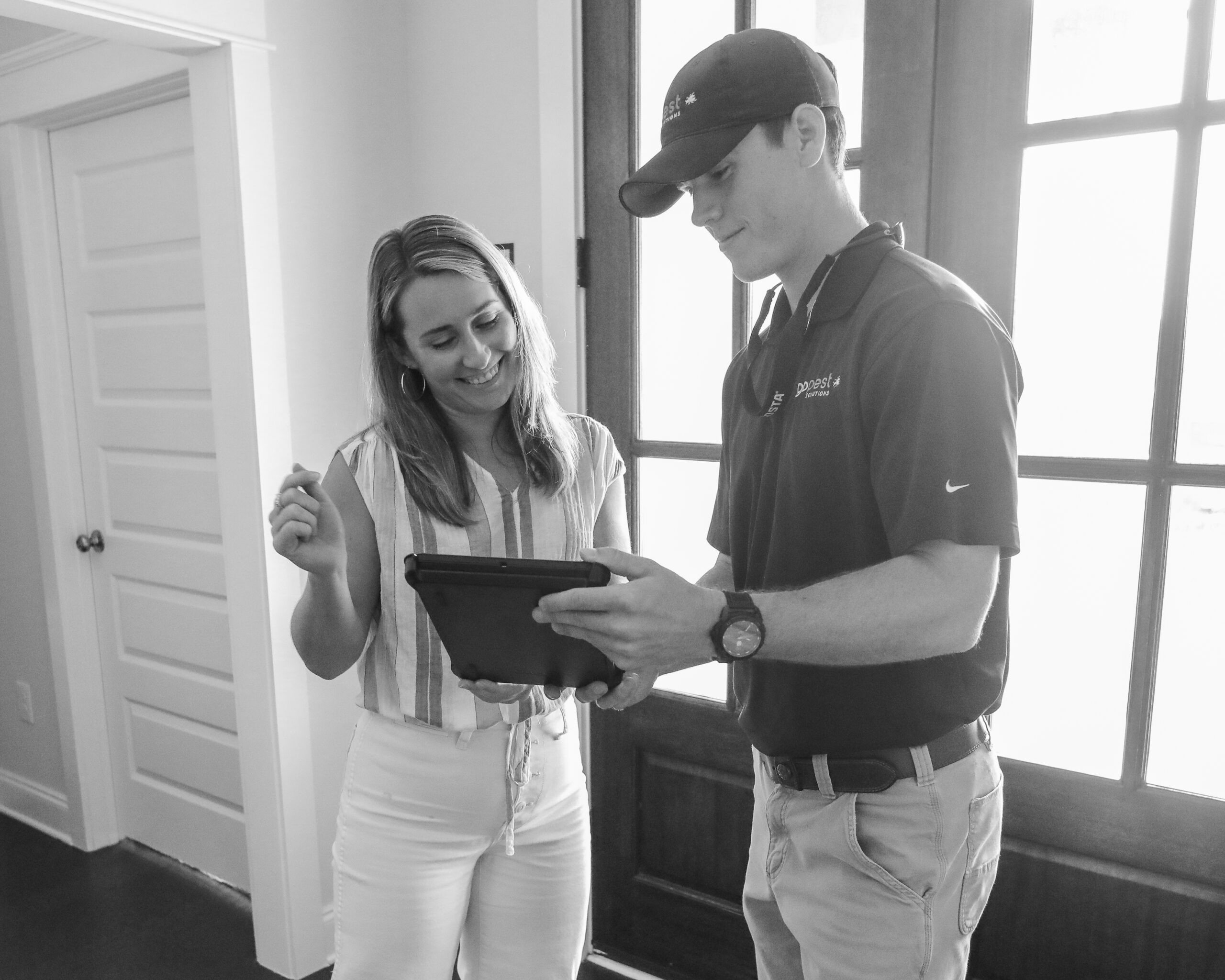 GoPest team member meeting homeowner sharing company values and quote